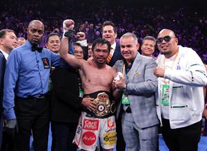 TOPSHOT - Filipino boxer Manny Pacquiao (C) celebrates after defeating US boxer Keith Thurman during their WBA super world welterweight title fight at the MGM Grand Garden Arena on July 20, 2019 in Las Vegas, Nevada. - Pacquiao won a 12 round split decision. (Getty Images)