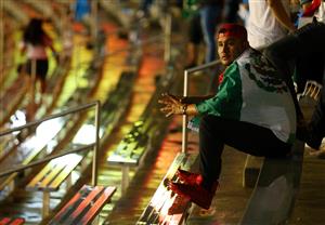 DALLAS, TEXAS - JULY 14: A Mexico fan waits out a weather delay before the game between Mexico and Guatemala at Cotton Bowl on July 14, 2021 in Dallas, Texas. (Getty Images)