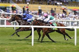 NEWBURY, ENGLAND - JULY 17: Marco Ghiani riding Real World (L) win The bet365 Stakes at Newbury Racecourse on July 17, 2021 in Newbury, England. Due to the Coronavirus pandemic, only owners along with a limited number of the paying public will be allowed to attend the meeting. (Photo by Alan Crowhurst/Getty Images)