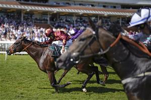 NEWBURY, ENGLAND - JULY 17: Sean Levey riding Gubbass (maroon) win The Weatherbys Super Sprint Stakes at Newbury Racecourse on July 17, 2021 in Newbury, England. Due to the Coronavirus pandemic, only owners along with a limited number of the paying public will be allowed to attend the meeting. (Photo by Alan Crowhurst/Getty Images)