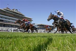 NEWBURY, ENGLAND - JULY 17: Sean Levey riding Gubbass (maroon) win The Weatherbys Super Sprint Stakes at Newbury Racecourse on July 17, 2021 in Newbury, England. Due to the Coronavirus pandemic, only owners along with a limited number of the paying public will be allowed to attend the meeting. (Photo by Alan Crowhurst/Getty Images)