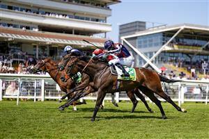NEWBURY, ENGLAND - JULY 17: Sean Levey riding Happy Romance (dark blue cap) win The bet365 Hackwood Stakes at Newbury Racecourse on July 17, 2021 in Newbury, England. Due to the Coronavirus pandemic, only owners along with a limited number of the paying public will be allowed to attend the meeting. (Photo by Alan Crowhurst/Getty Images)