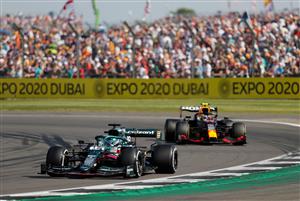 Aston Martin's Canadian driver Lance Stroll (L) drives during the Formula One British Grand Prix motor race at Silverstone motor racing circuit in Silverstone, central England on July 18, 2021. (Getty Images)