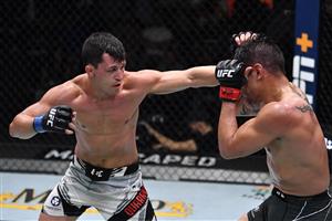 LAS VEGAS, NEVADA - JULY 17: In this handout photo provided by UFC, (L-R) Billy Quarantillo punches Gabriel Benitez of Mexico in their featherweight bout during the UFC Fight Night event at UFC APEX on July 17, 2021 in Las Vegas, Nevada. (Getty Images)