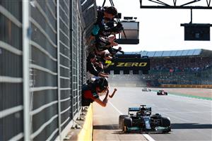 NORTHAMPTON, ENGLAND - JULY 18: Race winner Lewis Hamilton of Great Britain driving the (44) Mercedes AMG Petronas F1 Team Mercedes W12 passes his team celebrating on the pitwall during the F1 Grand Prix of Great Britain at Silverstone on July 18, 2021 in Northampton, England. (Getty Images)