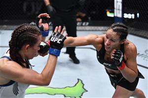 LAS VEGAS, NEVADA - JULY 17: In this handout photo provided by UFC, (R-L) Marion Reneau punches Miesha Tate in their bantamweight bout during the UFC Fight Night event at UFC APEX on July 17, 2021 in Las Vegas, Nevada. (Getty Images)