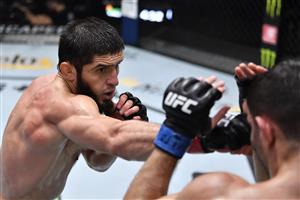 LAS VEGAS, NEVADA - JULY 17: In this handout photo provided by UFC, (L-R) Islam Makhachev of Russia punches Thiago Moises of Brazil in their lightweight bout during the UFC Fight Night event at UFC APEX on July 17, 2021 in Las Vegas, Nevada. (Getty Images)