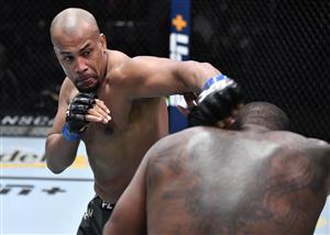 LAS VEGAS, NEVADA - JULY 17: In this handout photo provided by UFC, (L-R) Rodrigo Nascimento of Brazil punches Alan Baudot of France in their heavyweight bout during the UFC Fight Night event at UFC APEX on July 17, 2021 in Las Vegas, Nevada. (Getty Images)