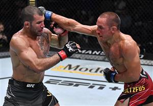 LAS VEGAS, NEVADA - JULY 17: In this handout photo provided by UFC, (R-L) Dustin Stoltzfus punches Rodolfo Vieira of Brazil in their middleweight bout during the UFC Fight Night event at UFC APEX on July 17, 2021 in Las Vegas, Nevada. (Getty Images)