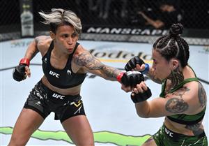 LAS VEGAS, NEVADA - JULY 17: In this handout photo provided by UFC, (L-R) Amanda Lemos of Brazil punches Montserrat Conejo of Mexico in their strawweight bout during the UFC Fight Night event at UFC APEX on July 17, 2021 in Las Vegas, Nevada. (Getty Images)