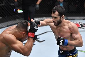 LAS VEGAS, NEVADA - JULY 17: In this handout photo provided by UFC, (R-L) Sergey Morozov of Kazakhstan punches Khalid Taha of Germany in their bantamweight bout during the UFC Fight Night event at UFC APEX on July 17, 2021 in Las Vegas, Nevada. (Getty Images)