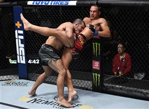 LAS VEGAS, NEVADA - JULY 17: In this handout photo provided by UFC, (L-R) Rodolfo Vieira of Brazil takes down Dustin Stoltzfus in their middleweight bout during the UFC Fight Night event at UFC APEX on July 17, 2021 in Las Vegas, Nevada. (Getty Images)