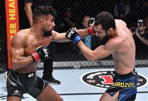 LAS VEGAS, NEVADA - JULY 17: In this handout photo provided by UFC, (L-R) Khalid Taha of Germany punches Sergey Morozov of Kazakhstan in their bantamweight bout during the UFC Fight Night event at UFC APEX on July 17, 2021 in Las Vegas, Nevada. (Getty Images)