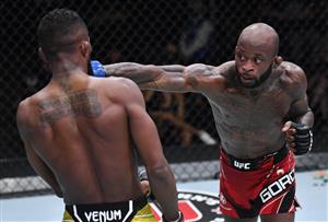 LAS VEGAS, NEVADA - JULY 17: In this handout photo provided by UFC, (R-L) Malcolm Gordon of Canada punches Francisco Figueiredo of Brazil in their flyweight bout during the UFC Fight Night event at UFC APEX on July 17, 2021 in Las Vegas, Nevada. (Getty Images)