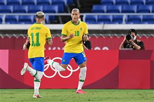 Brazil's forward Richarlison (R) celebrates with Brazil's forward Antony after opening the scoring during the Tokyo 2020 Olympic Games men's group D first round football match between Brazil and Germany at the Yokohama International Stadium in Yokohama on July 22, (Getty Images)