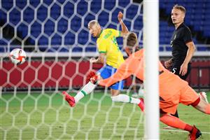 Brazil's forward Richarlison (Rear) shoots to open the scoring during the Tokyo 2020 Olympic Games men's group D first round football match between Brazil and Germany at the Yokohama International Stadium in Yokohama on July 22, (Getty Images)