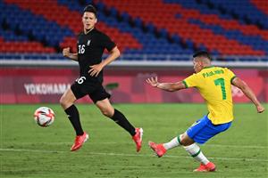 Brazil's midfielder Paulinho (R) shoots to score his side's fourth goal during the Tokyo 2020 Olympic Games men's group D first round football match between Brazil and Germany at the Yokohama International Stadium in Yokohama on July 22, 2021. (Getty Images)