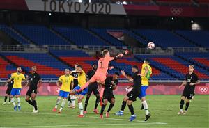 Germany's goalkeeper Florian Mueller (C) deflects a centre during the Tokyo 2020 Olympic Games men's group D first round football match between Brazil and Germany at the Yokohama International Stadium in Yokohama on July 22, 2021. (Getty Images)