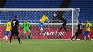 Germany's forward Ragnar Ache (3rdR) jumps to score a header and Germany's second goal during the Tokyo 2020 Olympic Games men's group D first round football match between Brazil and Germany at the Yokohama International Stadium in Yokohama on July 22, 2021. (Getty Images)