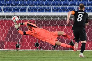 Germany's goalkeeper Florian Mueller deflects a penalty during the Tokyo 2020 Olympic Games men's group D first round football match between Brazil and Germany at the Yokohama International Stadium in Yokohama on July 22, 2021. (Getty Images)