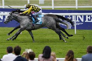 ASCOT, ENGLAND - JULY 23: David Probert riding Alfred Boucher (yellow/black check) win The John Guest Racing Handicap at Ascot Racecourse on July 23, 2021 in Ascot, England. (Photo by Alan Crowhurst/Getty Images)