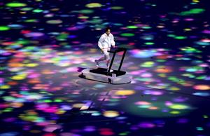 TOKYO, JAPAN - JULY 23: A performer runs on a treadmill during the Opening Ceremony of the Tokyo 2020 Olympic Games at Olympic Stadium on July 23, 2021 in Tokyo, Japan (Getty Images)
