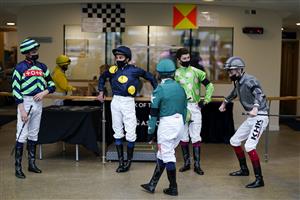 ASCOT, ENGLAND - JULY 24: A general view as jockeys chat before being called to the parade ring at Ascot Racecourse on July 24, 2021 in Ascot, England. (Photo by Alan Crowhurst/Getty Images)