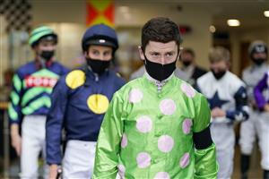 ASCOT, ENGLAND - JULY 24: Oisin Murphy leads the jockeys out for the second race at Ascot Racecourse on July 24, 2021 in Ascot, England. (Photo by Alan Crowhurst/Getty Images)