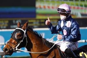 SYDNEY, AUSTRALIA - JULY 24: Brock Ryan on No Compromise returns to scale after winning race 5 the Schweppes Handicap during Sydney Racing at Rosehill Gardens on July 24, 2021 in Sydney, Australia. (Photo by Mark Evans/Getty Images)
