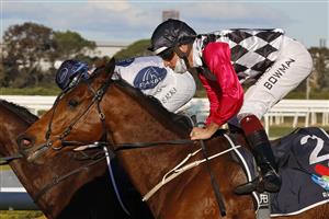 SYDNEY, AUSTRALIA - JULY 24: Hugh Bowman on Casino Mondial (red sleeves) wins race 8 the Midway Handicap during Sydney Racing at Rosehill Gardens on July 24, 2021 in Sydney, Australia. (Photo by Mark Evans/Getty Images)