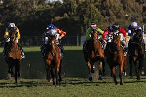 SYDNEY, AUSTRALIA - JULY 24: Hugh Bowman on Casino Mondial (red sleeves) wins race 8 the Midway Handicap during Sydney Racing at Rosehill Gardens on July 24, 2021 in Sydney, Australia. (Photo by Mark Evans/Getty Images)