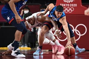 USA's Devin Booker (R) fights for the ball with France's Guerschon Yabusele during the men's preliminary round group A basketball match between France and USA during the Tokyo 2020 Olympic Games at the Saitama Super Arena in Saitama on July 25, 2021. (Getty Images)