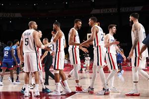 French players celebrate after their win in the men's preliminary round group A basketball match between France and USA during the Tokyo 2020 Olympic Games at the Saitama Super Arena in Saitama on July 25, 2021. (Getty Images)