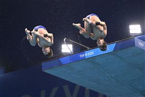 Japan's Kazuki Murakami and Japan's Hiroki Ito compete in the men's synchronised 10m platform diving final event during the Tokyo 2020 Olympic Games at the Tokyo Aquatics Centre in Tokyo on July 26, 2021. (Getty Images)