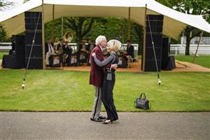 CHICHESTER, ENGLAND - JULY 27: A couple dance as the band plays on during the Qatar Goodwood Festival at Goodwood Racecourse on July 27, 2021 in Chichester, England. (Photo by Alan Crowhurst/Getty Images)