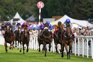 CHICHESTER, ENGLAND - JULY 27: Hollie Doyle riding Trueshan (R, blue/yellow) win The Al Shaqab Goodwood Cup Stakes during the Qatar Goodwood Festival at Goodwood Racecourse on July 27, 2021 in Chichester, England. (Photo by Alan Crowhurst/Getty Images)