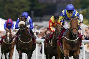 CHICHESTER, ENGLAND - JULY 27: Hollie Doyle riding Trueshan (R, blue/yellow) win The Al Shaqab Goodwood Cup Stakes during the Qatar Goodwood Festival at Goodwood Racecourse on July 27, 2021 in Chichester, England. (Photo by Alan Crowhurst/Getty Images)