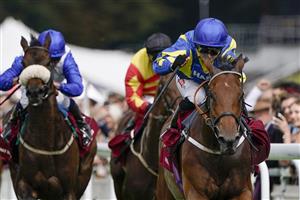 CHICHESTER, ENGLAND - JULY 27: Hollie Doyle riding Trueshan (R, blue/yellow) win The Al Shaqab Goodwood Cup Stakes during the Qatar Goodwood Festival at Goodwood Racecourse on July 27, 2021 in Chichester, England. (Photo by Alan Crowhurst/Getty Images)
