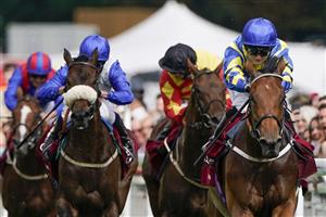 CHICHESTER, ENGLAND - JULY 27: Hollie Doyle riding Trueshan (R, blue/yellow) win The Al Shaqab Goodwood Cup Stakes during the Qatar Goodwood Festival at Goodwood Racecourse on July 27, 2021 in Chichester, England. (Photo by Alan Crowhurst/Getty Images)