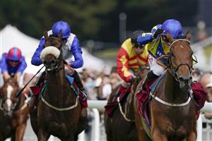 CHICHESTER, ENGLAND - JULY 27: Hollie Doyle riding Trueshan (R, blue/yellow) win The Al Shaqab Goodwood Cup Stakes during the Qatar Goodwood Festival at Goodwood Racecourse on July 27, 2021 in Chichester, England. (Photo by Alan Crowhurst/Getty Images)