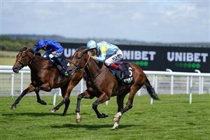 CHICHESTER, ENGLAND - JULY 28: David Egan riding Nagano (light blue/yellow) win The Unibet '15 To Go' Handicap during the Qatar Goodwood Festival at Goodwood Racecourse on July 28, 2021 in Chichester, England. (Photo by Alan Crowhurst/Getty Images)
