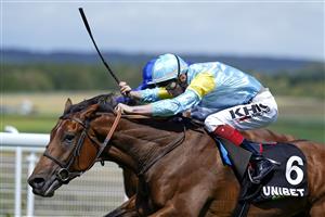 CHICHESTER, ENGLAND - JULY 28: David Egan riding Nagano (light blue/yellow) win The Unibet '15 To Go' Handicap during the Qatar Goodwood Festival at Goodwood Racecourse on July 28, 2021 in Chichester, England. (Photo by Alan Crowhurst/Getty Images)