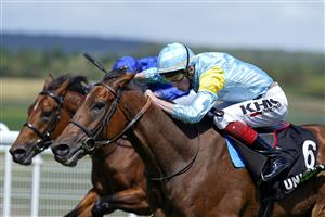CHICHESTER, ENGLAND - JULY 28: David Egan riding Nagano (light blue/yellow) win The Unibet '15 To Go' Handicap during the Qatar Goodwood Festival at Goodwood Racecourse on July 28, 2021 in Chichester, England. (Photo by Alan Crowhurst/Getty Images)