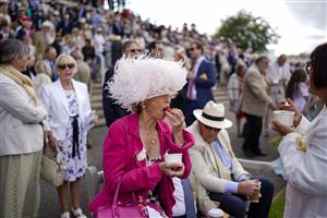 CHICHESTER, ENGLAND - JULY 28: Free strawberries for racegoers during the Qatar Goodwood Festival at Goodwood Racecourse on July 28, 2021 in Chichester, England. (Photo by Alan Crowhurst/Getty Images)