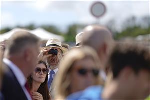 CHICHESTER, ENGLAND - JULY 28: Trying to get a view as runners near the finish in The Whispering Angel Oak Tree Stakes during the Qatar Goodwood Festival at Goodwood Racecourse on July 28, 2021 in Chichester, England. (Photo by Alan Crowhurst/Getty Images)