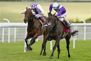 CHICHESTER, ENGLAND - JULY 28: Oisin Murphy riding Alcohol Free (R) win The Qatar Sussex Stakes from Poetic Flare and Kevin Manning (L) during the Qatar Goodwood Festival at Goodwood Racecourse on July 28, 2021 in Chichester, England. (Photo by Alan Crowhurst/Getty Images)