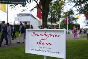 CHICHESTER, ENGLAND - JULY 29: Racegoers make their way into the tack on Ladies Day during the Qatar Goodwood Festival at Goodwood Racecourse on July 29, 2021 in Chichester, England. (Photo by Alan Crowhurst/Getty Images)