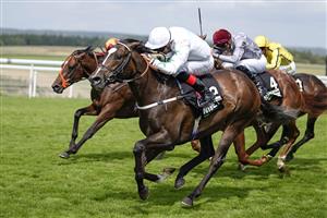 CHICHESTER, ENGLAND - JULY 29: Martin Harley riding Asymmetric (white) win The Unibet Richmond Stakes during the Qatar Goodwood Festival at Goodwood Racecourse on July 29, 2021 in Chichester, England. (Photo by Alan Crowhurst/Getty Images)