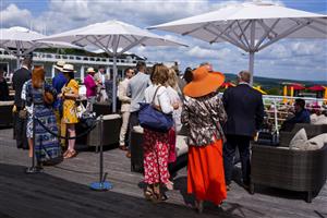CHICHESTER, ENGLAND - JULY 29: Enjoying the Champagne Bar during the Qatar Goodwood Festival at Goodwood Racecourse on July 29, 2021 in Chichester, England. (Photo by Alan Crowhurst/Getty Images)