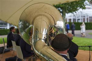 CHICHESTER, ENGLAND - JULY 30: The band plays as racegoers arrive on day four during the Qatar Goodwood Festival at Goodwood Racecourse on July 30, 2021 in Chichester, England. (Photo by Alan Crowhurst/Getty Images)